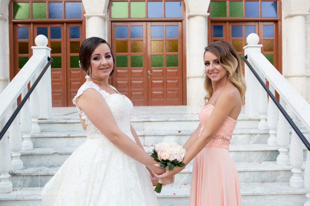 The bride and her sister, just as they posed as kids